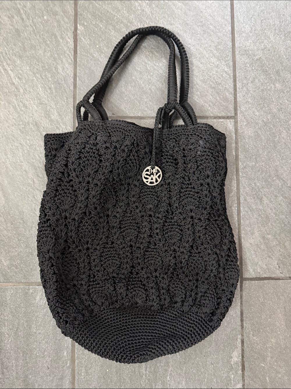 The Sak Black Crochet Tote with Logo Charm